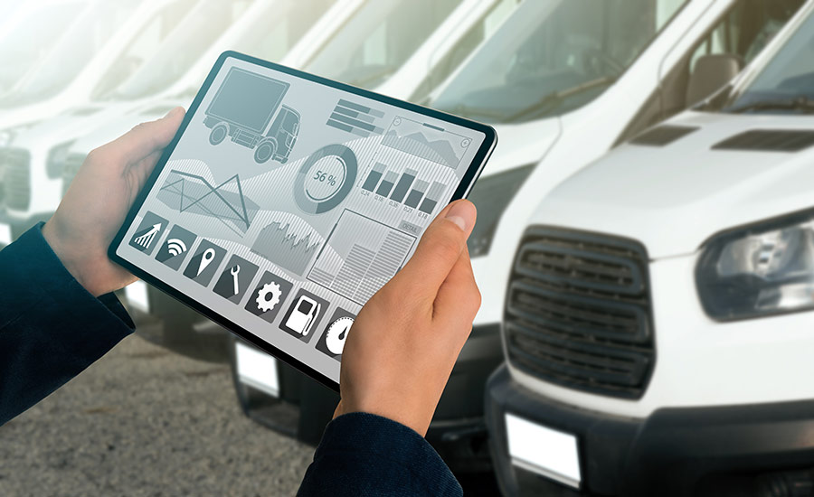 A commercial vehicle owner checking the drivers' maintenance report on a tablet​