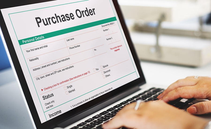A person uses forms management software to create a purchase order​