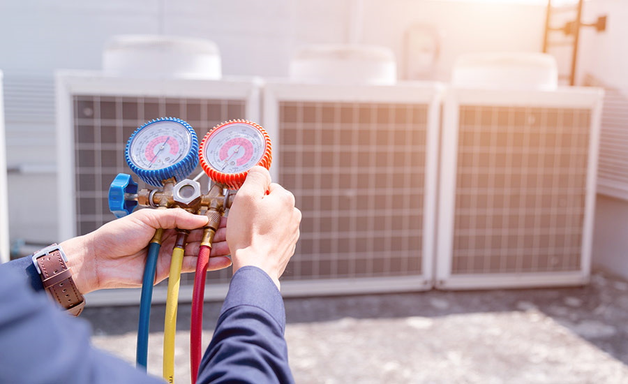 A/C technician prepares to install a new air conditioner​