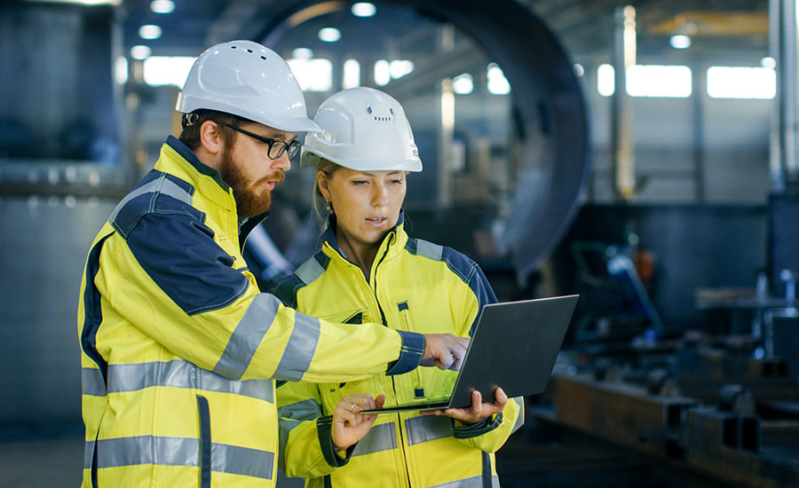 Two men checking safety in their workplace​