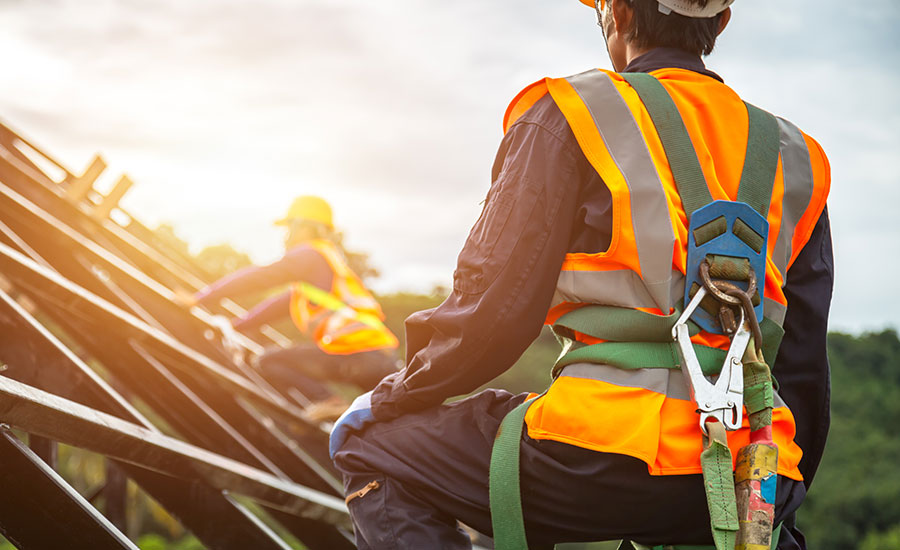 Workers conducting an equipment safety inspection