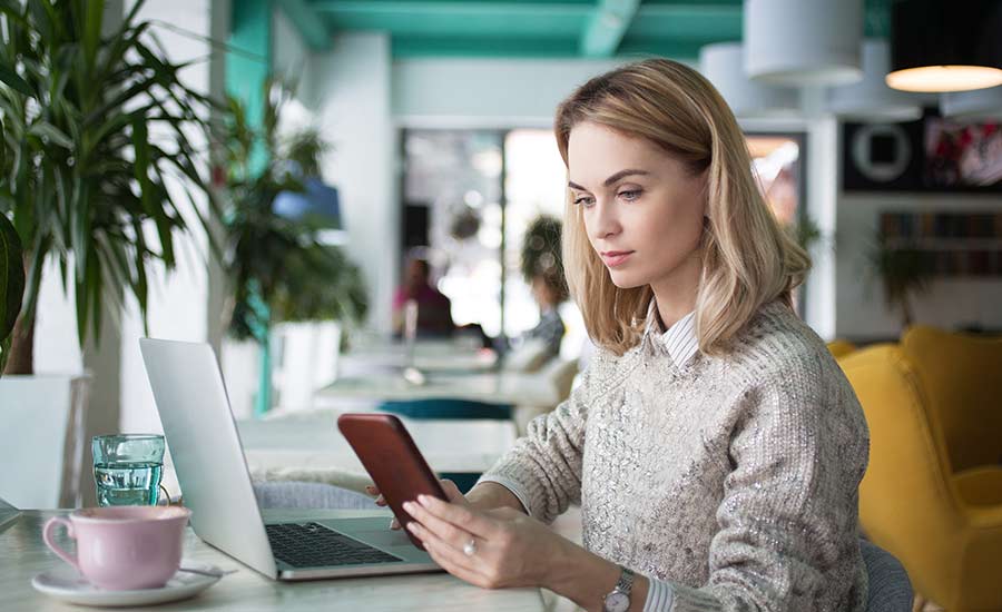 A woman working from a cafe