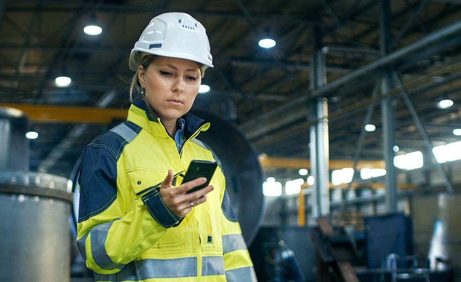 A female employee using her mobile phone​