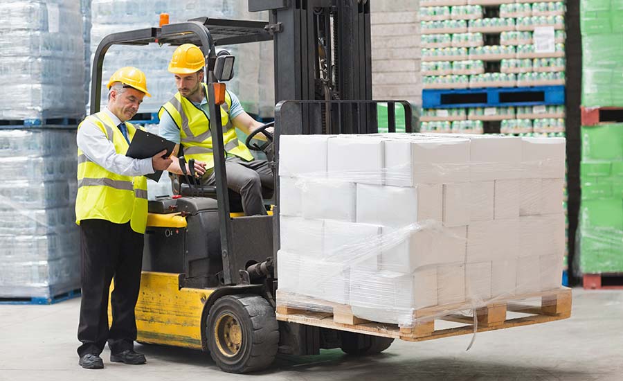 An image depicting an operating in a forklift discussing something with another man