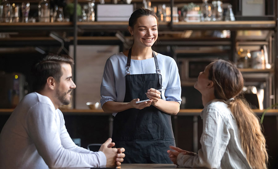 Waitress talking to the customers