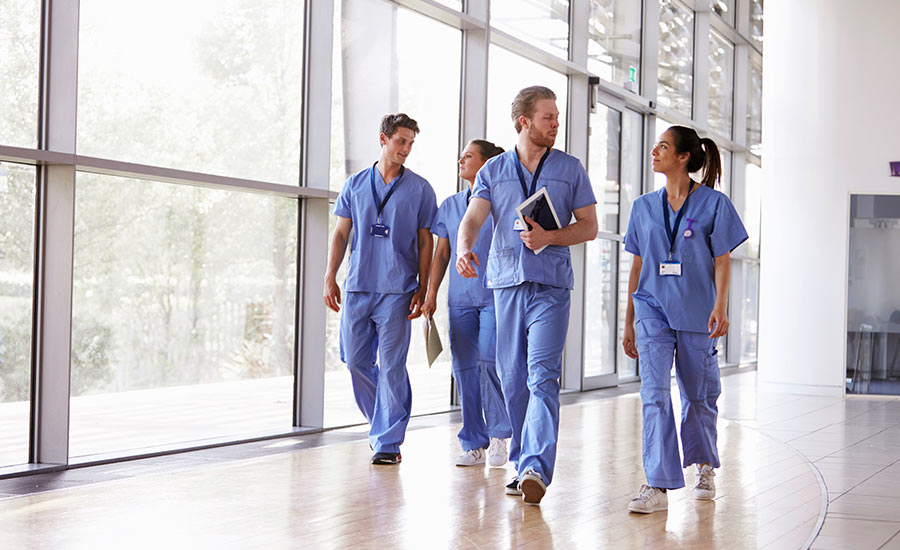 A group of healthcare professionals walking