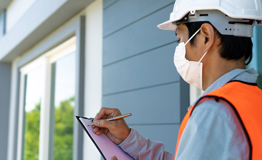 An engineer inspecting a residential home