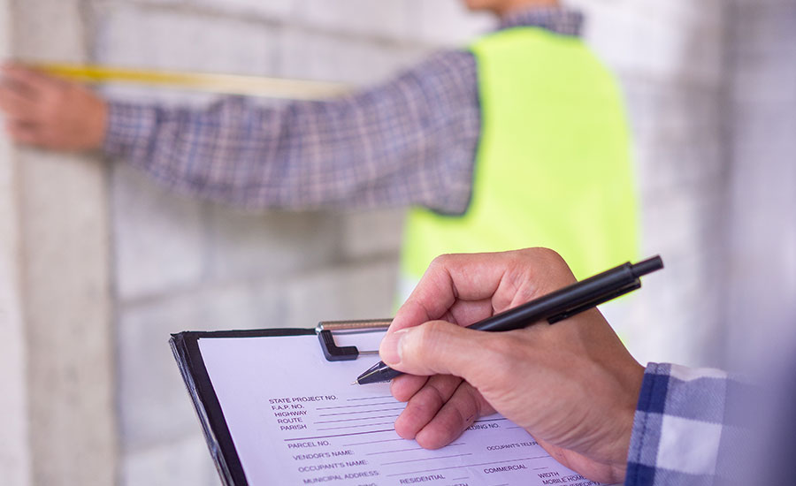 A subcontractor filling out a daily report for construction​