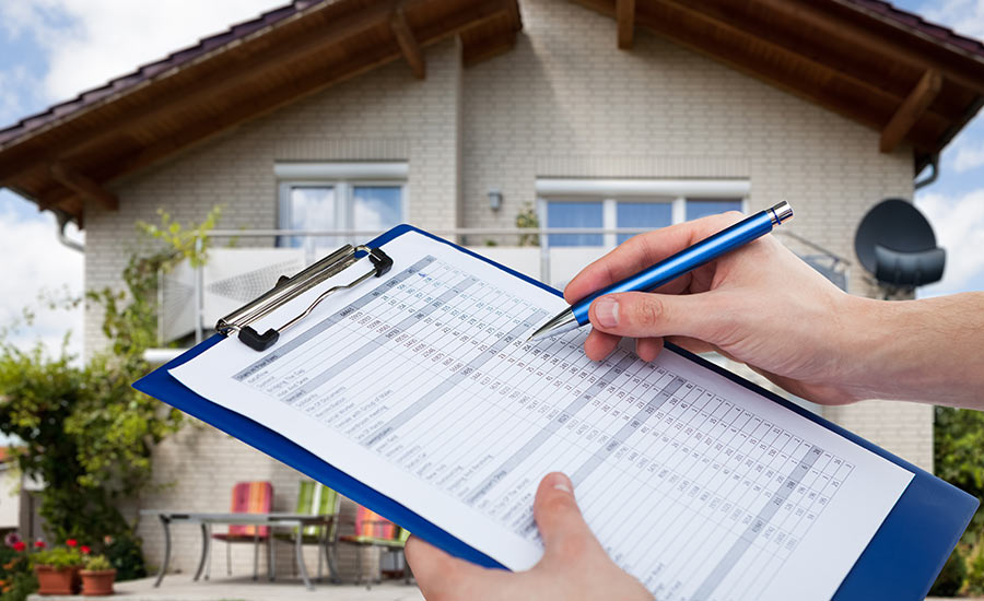 An FHA inspector documenting inspection findings​
