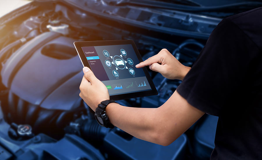 An automotive technician performing car diagnostics​