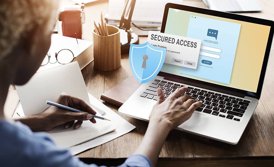 A woman looking at a "secured access" message on a laptop ​