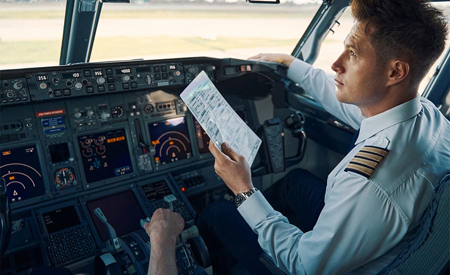 A pilot checking the equipment in the cockpit​