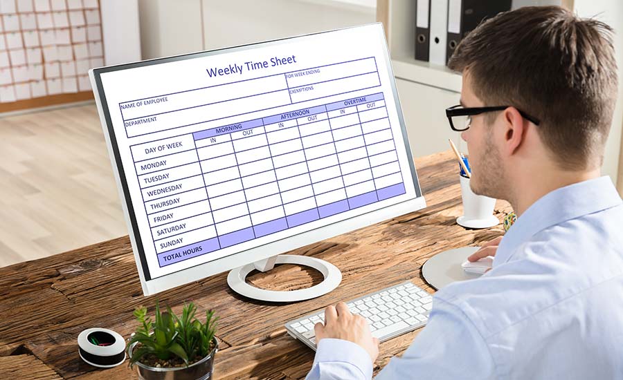 A man filling in a weekly timesheet​