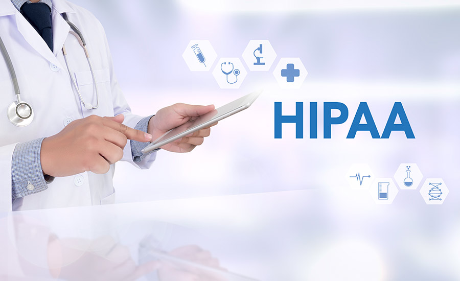 A man holding a HIPAA compliance form