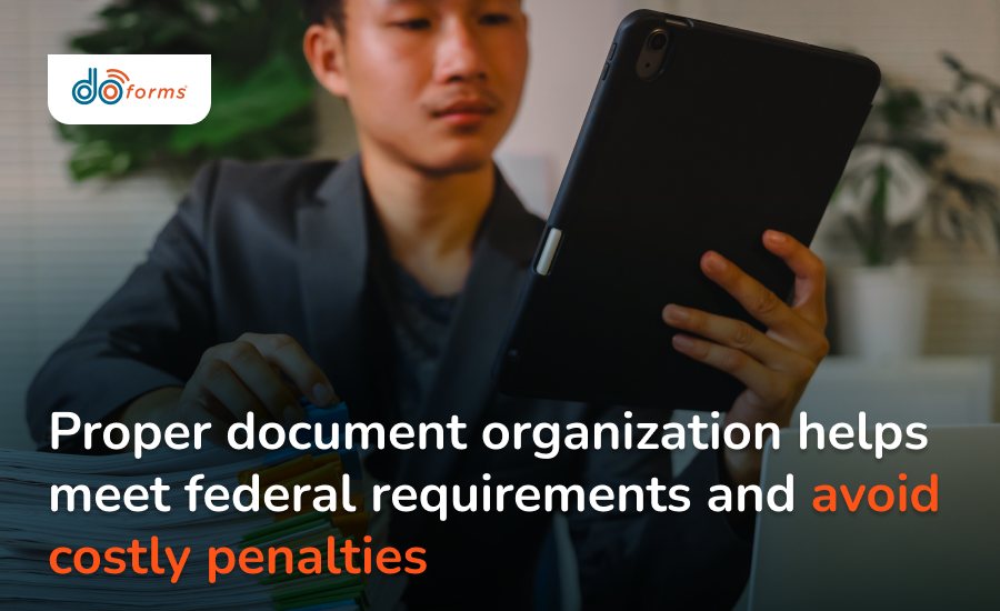 A man looking at digital documents on his tablet while prepping for a compliance audit